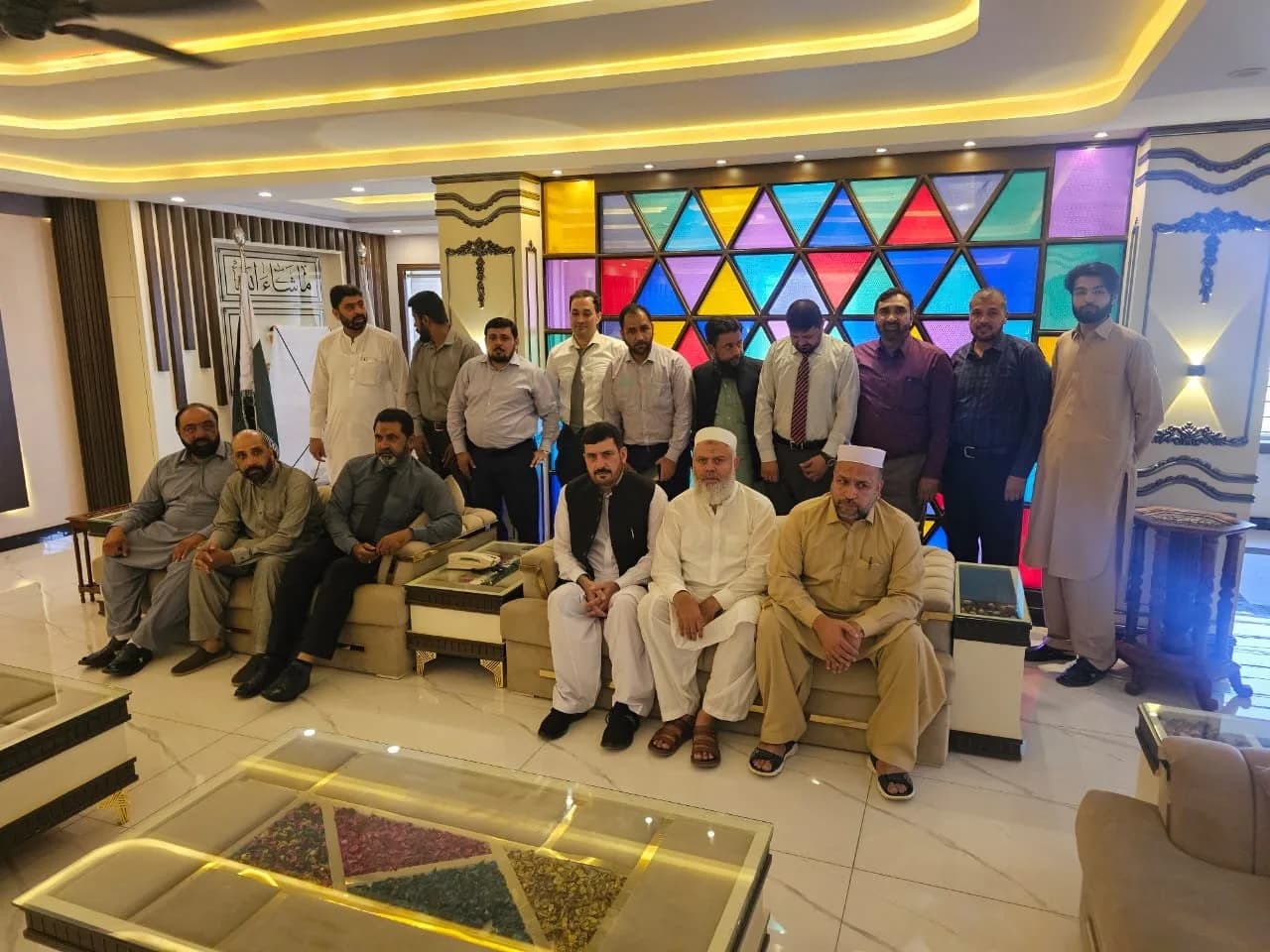 The team seated together in the office lobby