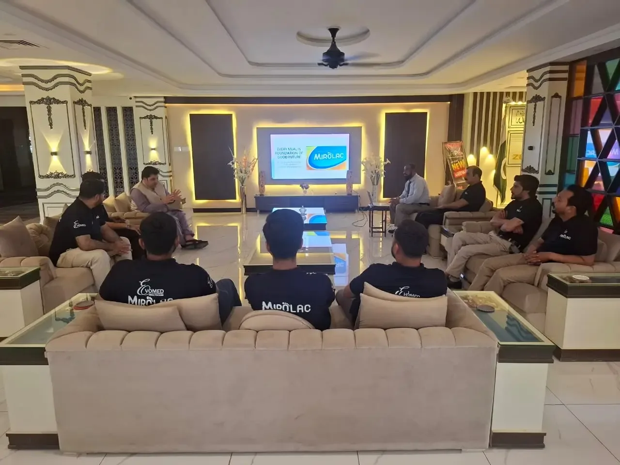 Team members seated during the briefing